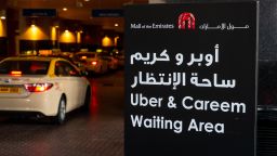 A taxi rank sign for Uber Technologies Inc. and Careem Networks FZ drivers stands at the Mall of the Emirates in Dubai, United Arab Emirates, on Sunday, Oct. 7, 2018. Careem last month acquired Indian bus shuttle service app Commut as the Dubai-based ride-hailing firm expands into mass transport. Photographer: Christopher Pike/Bloomberg via Getty Images