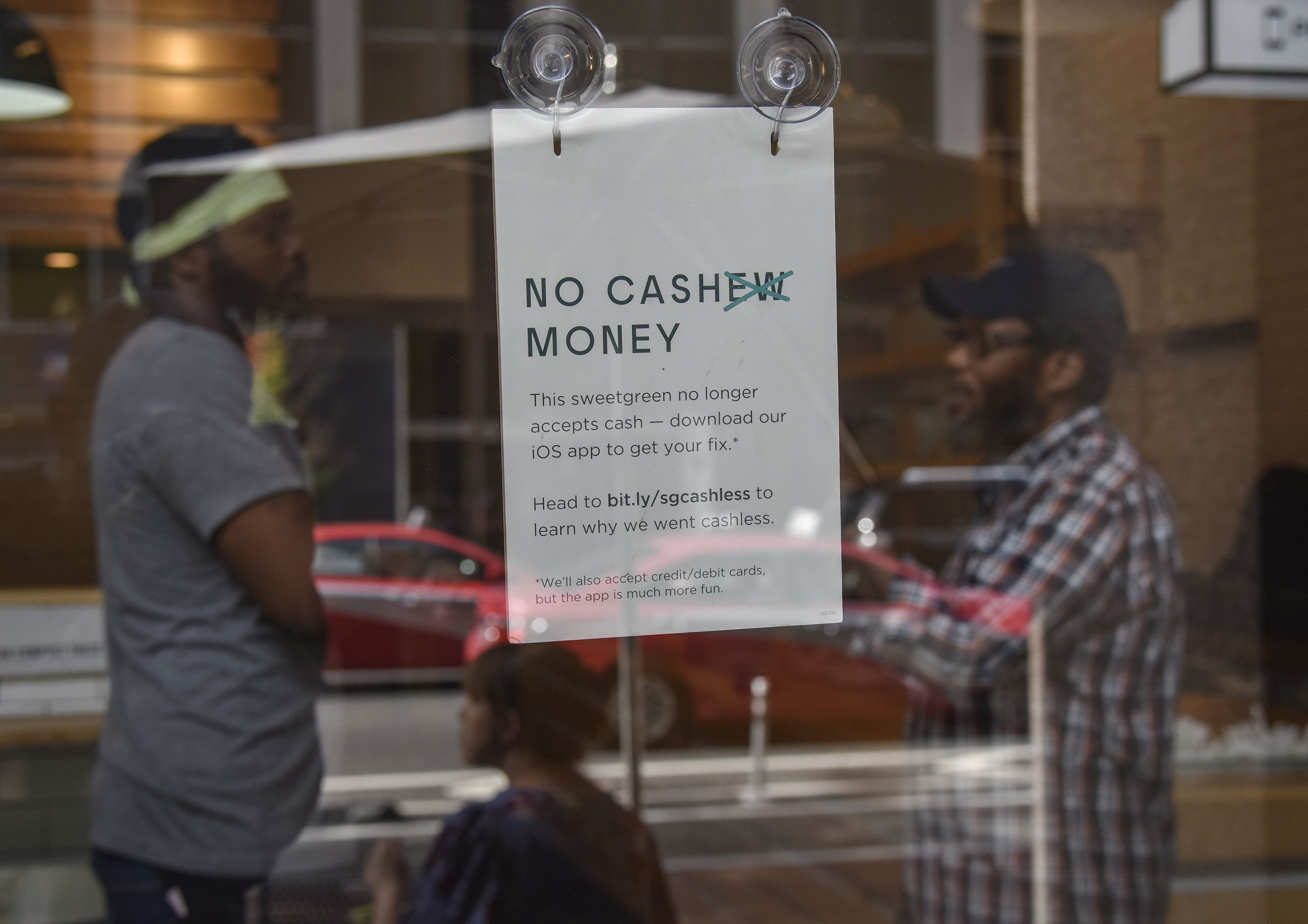 Retailers want to go cashless. But opponents say that's discriminatory