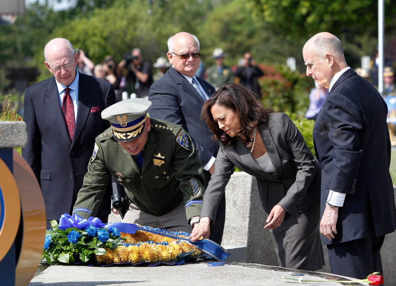 In May 2013, Harris and California Highway Patrol Commissioner Joe Farrow place a wreath honoring Highway Patrol officers who were killed in the line of duty. 