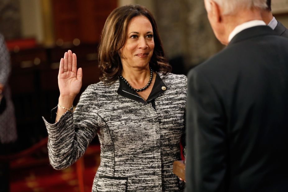 Harris, as a new member of the Senate, participates in a re-enacted swearing-in with Vice President Joe Biden in January 2017. She is the first Indian-American and the second African-American woman to serve as a US senator.