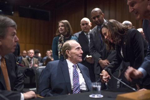 Harris talks with former US Sen. Bob Dole on Capitol Hill in January 2017.