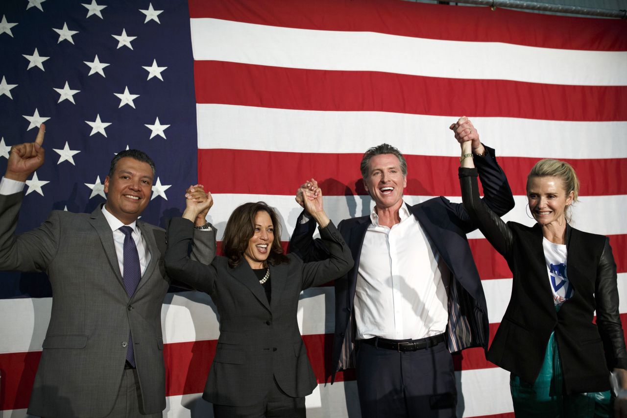 Harris attends a rally with, from left, California Secretary of State Alex Padilla, gubernatorial candidate Gavin Newsom, and Newsom's wife, Jennifer, in May 2018. Newsom won the election in November.