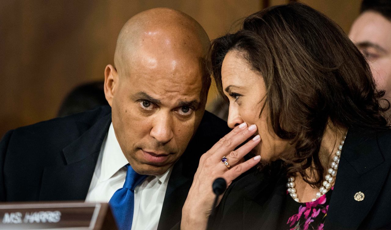 Harris speaks with US Sen. Cory Booker during the confirmation hearing for Supreme Court nominee Brett Kavanaugh in September 2018.