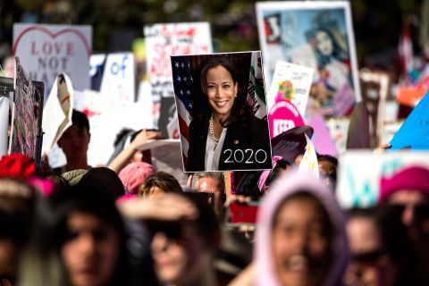A person holds a Harris poster during the Women's March in Los Angeles in January 2019.