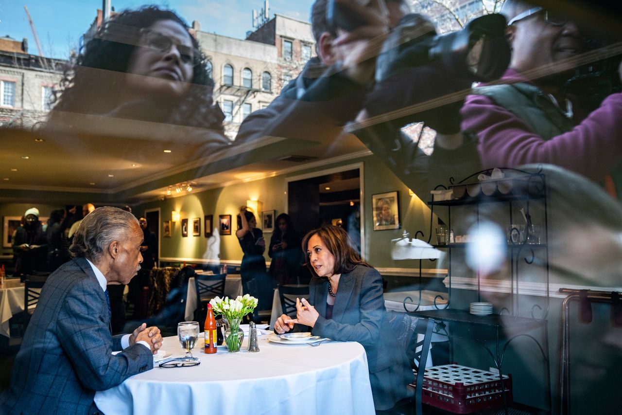 Media members photograph Harris and the Rev. Al Sharpton as they have lunch at Sylvia's Restaurant in New York in February 2019.