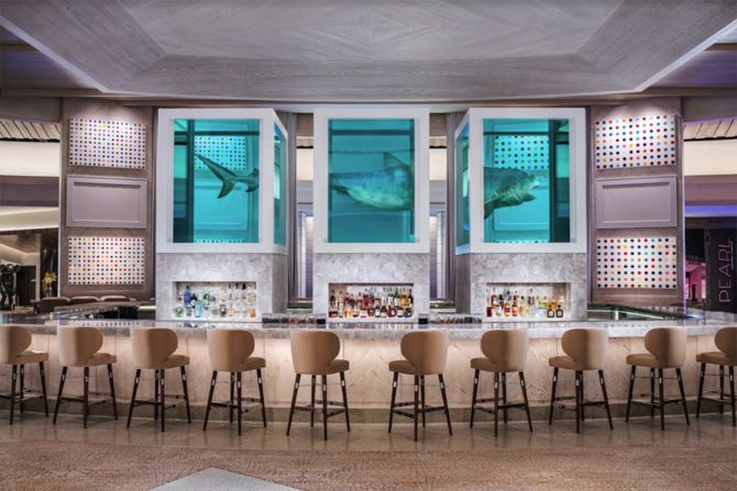 <strong>The Unknown Bar.</strong> Damien Hirst's "The Unknown (Explored, Explained, Exploded)" features a 13-foot-long tiger shark divided into three parts and suspended in formaldehyde, looming ominously atop Unknown Bar in the center of the casino.