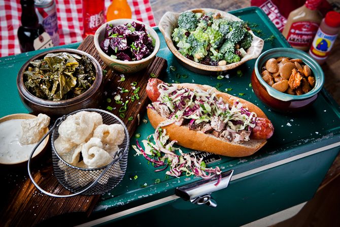 <strong>BBQ fit for Las Vegas. </strong>The Sausage, a popular dish at Mabel's BBQ from Chef Michael Symon, pictured here with sides.