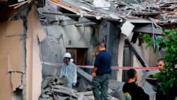 A general view shows emergency responders inspecting a damaged house after it was hit by a rocket in the village of Mishmeret, north of Tel Aviv on March 25, 2019. - A rocket hit a house in a community north of Tel Aviv and caused it to catch fire on Monday, wounding five Israelis, police and medics said. (Photo by Jack GUEZ / AFP)        (Photo credit should read JACK GUEZ/AFP/Getty Images)