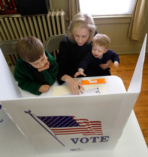 Gillibrand votes with her sons Theo, left, and Henry in November 2010.