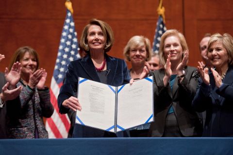 Gillibrand joins House Speaker Nancy Pelosi during the signing of the bill that repealed the US military's "don't ask, don't tell" policy in December 2010.