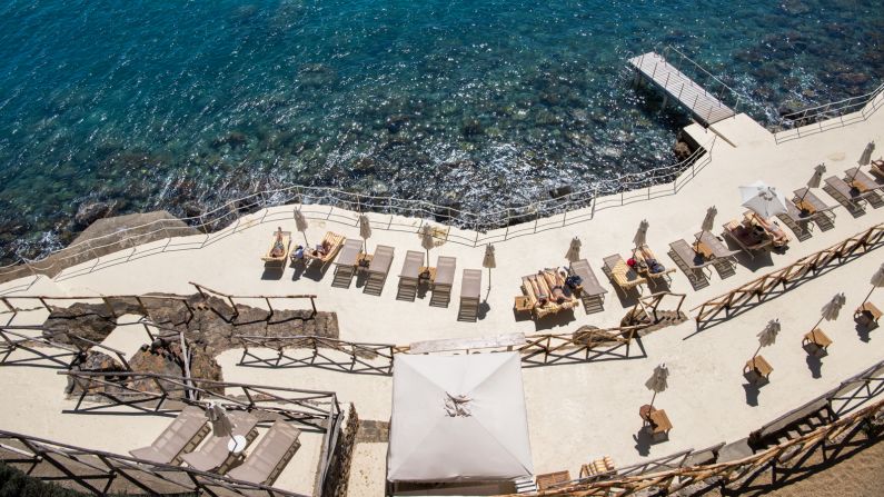 <strong>Glamorous setting: </strong>The five-star hotel has 50 rooms and a large pool with steps that lead to a private concrete beach with glimmering cobalt water.