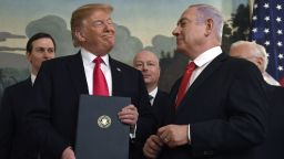 President Donald Trump smiles at Israeli Prime Minister Benjamin Netanyahu, right, after signing a proclamation in the Diplomatic Reception Room at the White House in Washington, Monday, March 25, 2019. Trump signed an official proclamation formally recognizing Israel's sovereignty over the Golan Heights. (AP Photo/Susan Walsh)