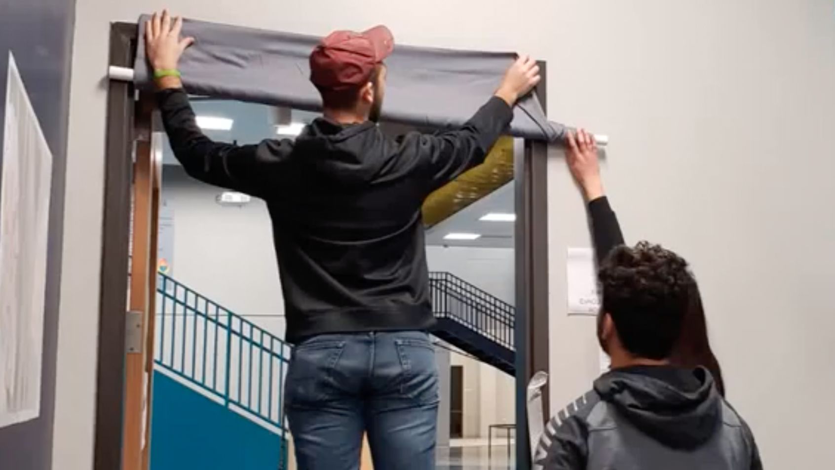 Richland Two Institute students put up a curtain that can be remotely lowered to block a shooter's visibility.