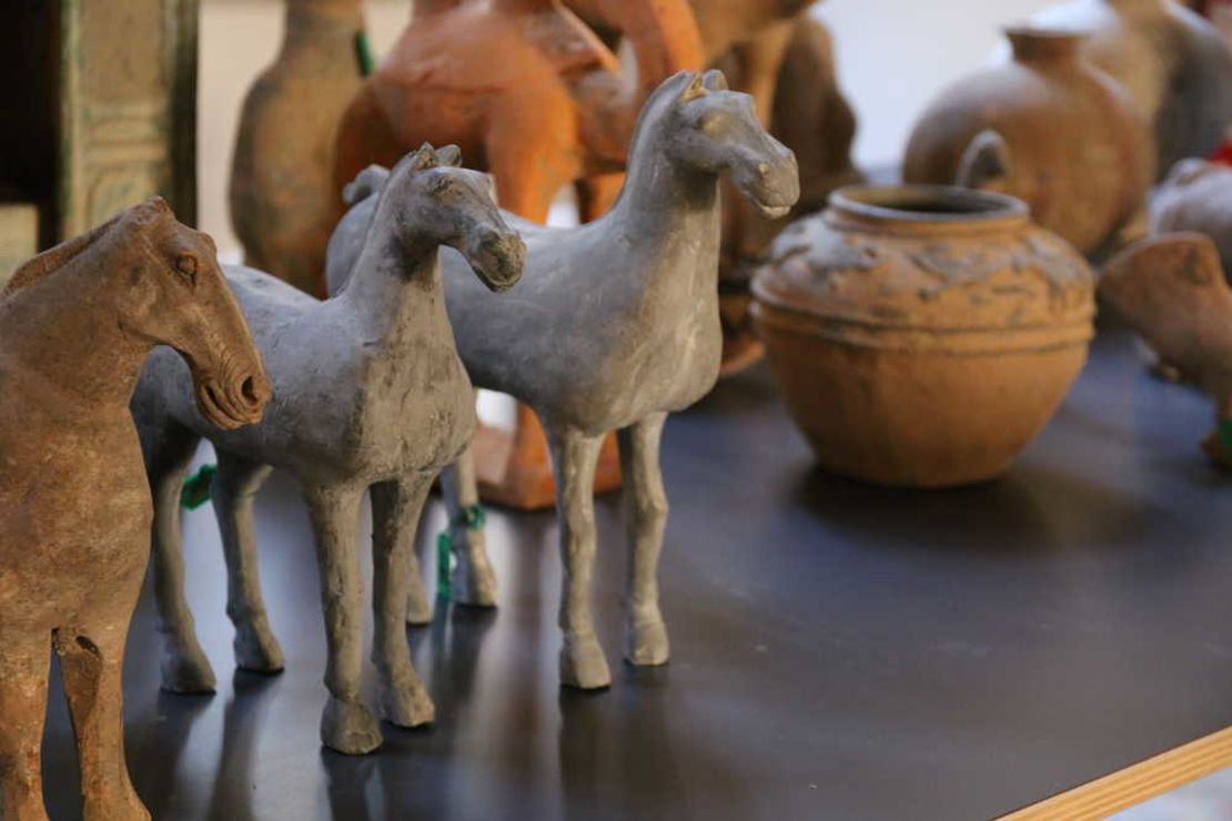 The relics include ancient pots and sculptures.