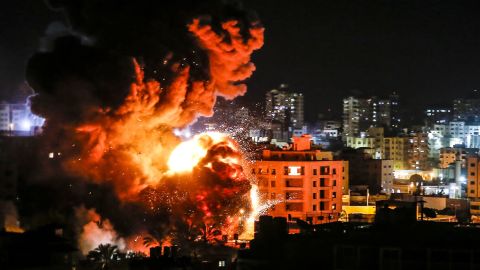 Fire and smoke billow above buildings in Gaza City during Israeli strikes on March 25.
