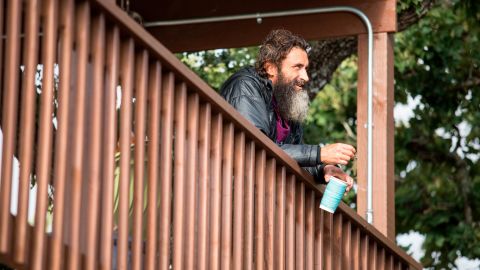 A resident looks out from the top deck of his new home in the Community First! Village in Austin, Texas.