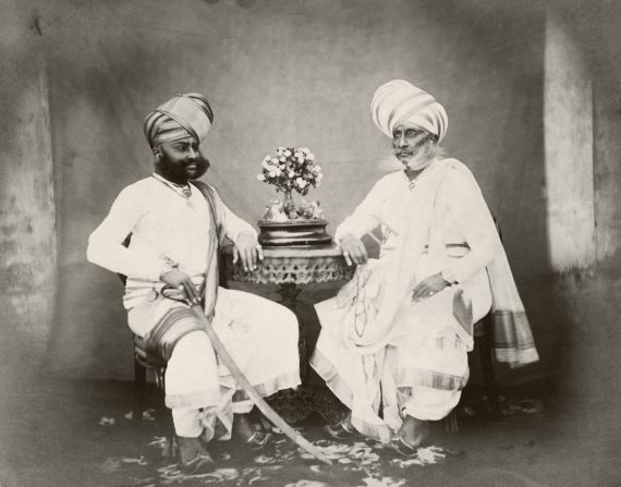 Studio portraits, like this one from 1867, became popular among India's merchant classes and other wealthy individuals.