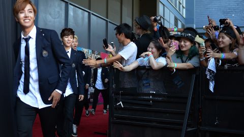 Members of BTS arrive at K-CON at the Los Angeles Memorial Sports Arena on August 10, 2014.  
