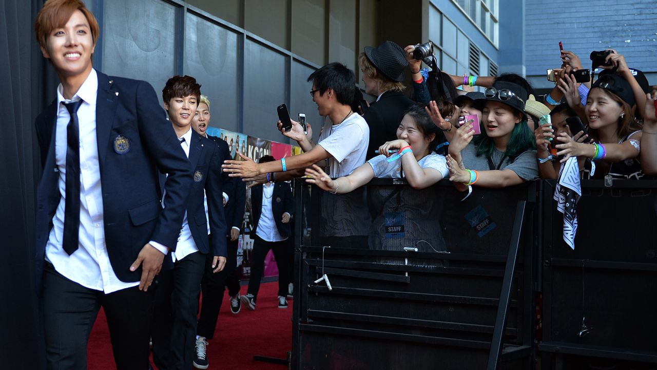 Members of BTS arrive at K-CON at the Los Angeles Memorial Sports Arena on August 10, 2014.