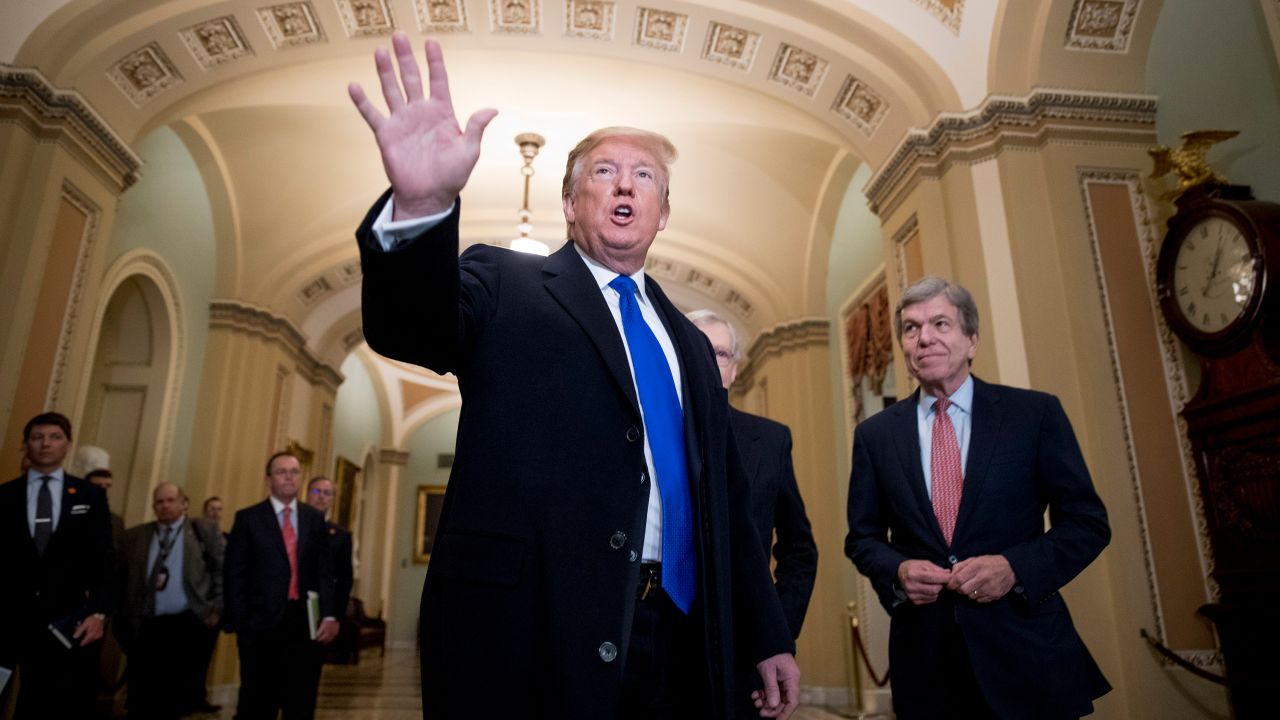 President Donald Trump accompanied by Sen. Roy Blunt, R-Mo., right, arrives for a Senate Republican policy lunch on Capitol Hill in Washington, Tuesday, March 26, 2019. (AP Photo/Andrew Harnik)