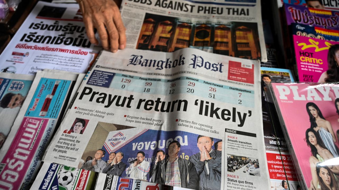 Newspapers at a shop in Bangkok trumpet coverage of the general election.