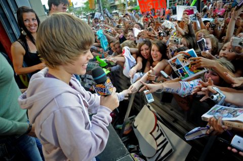 Bieber greets fans in Toronto in August 2009. His first single, "One Time," came out a couple months earlier and went platinum. He followed that up with his debut EP, "My World," in November 2009. It also went platinum.