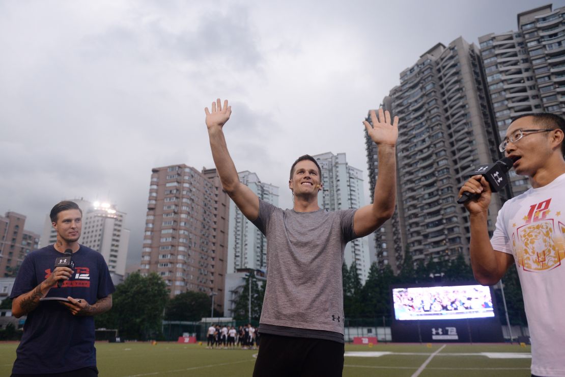Brady waves to fans during a promotional event in Shanghai in 2017.