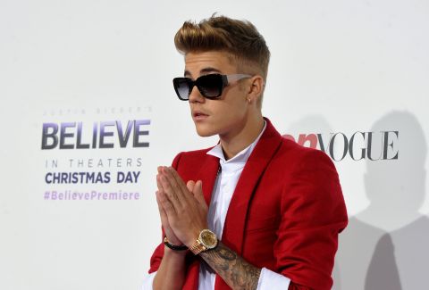 Bieber attends a movie premiere for his concert film "Believe" in December 2013. Bieber was raised in a Christian household by his evangelical mother, Pattie, and he frequently references God in his social-media posts. In a 2011 interview with Rolling Stone magazine, Bieber said: "I feel I have an obligation to plant little seeds with my fans. I'm not going to tell them, 'You need Jesus,' but I will say at the end of my show, 'God loves you.' "