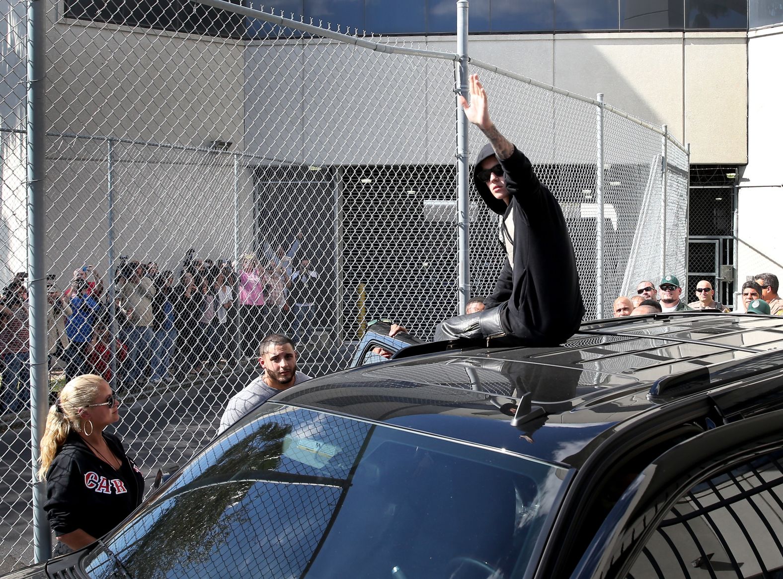 Bieber waves after exiting the correctional center following his arrest. Earlier that month, sheriff's deputies searched his California home over the egging of a neighbor's house. <a href="https://www.cnn.com/2014/07/09/showbiz/justin-bieber-vandalism/" target="_blank">Bieber later accepted a plea deal</a> to settle a misdemeanor vandalism charge.