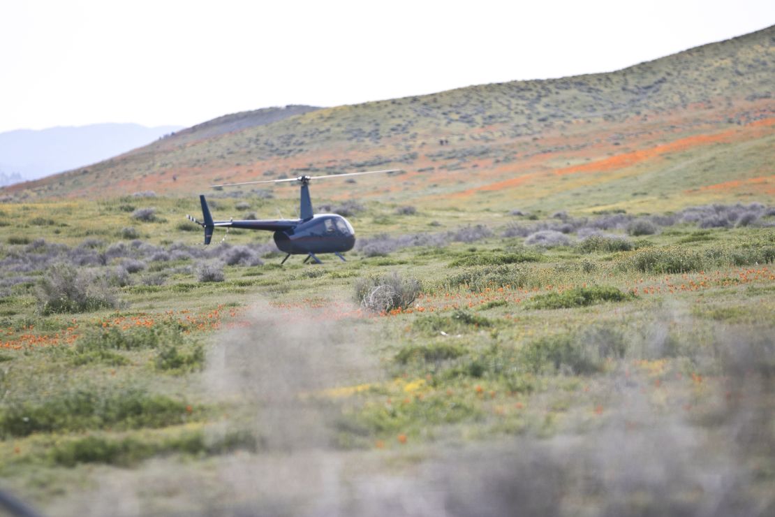 A helicopter is spotted at the Antelope Valley California Poppy Reserve on Monday. 
