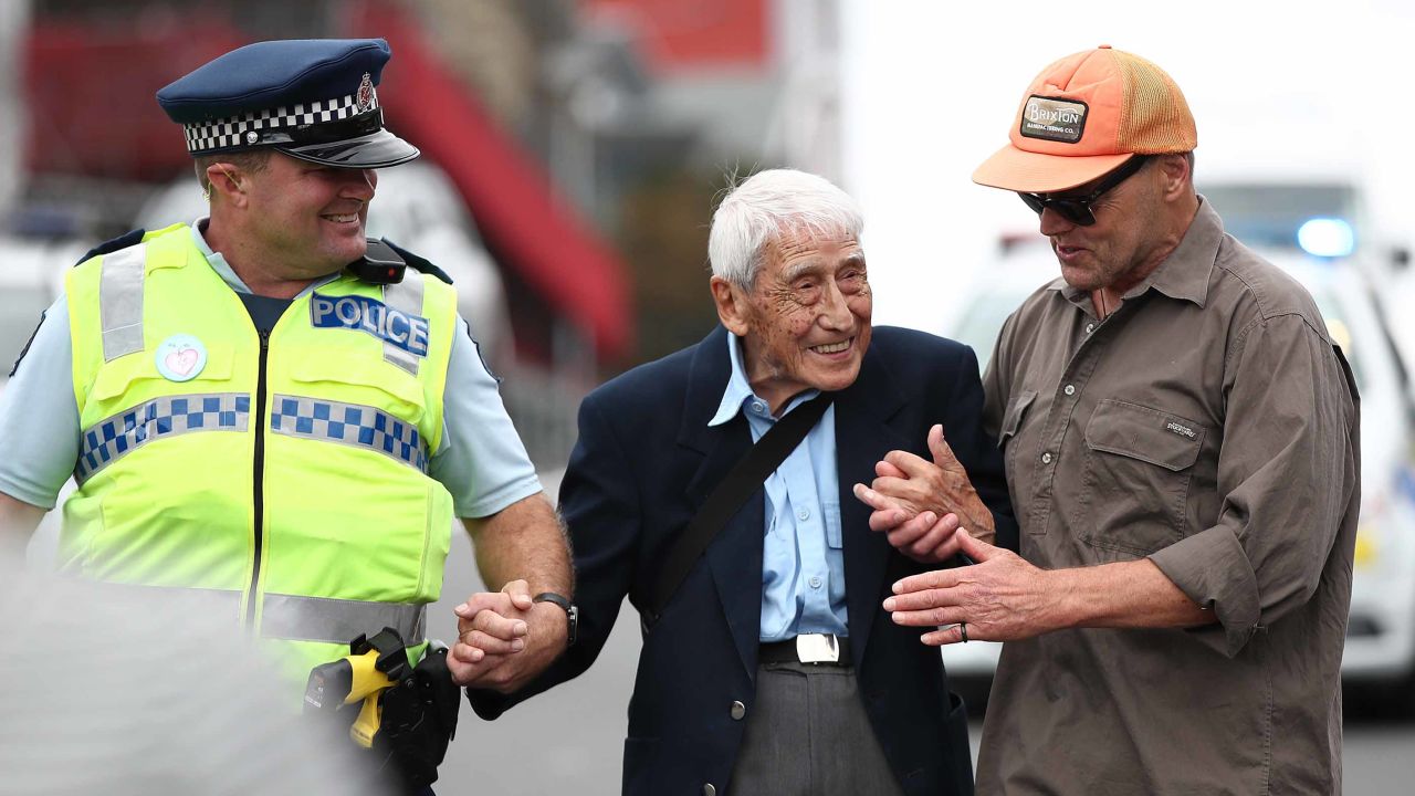 John Sato, center, attends a march against racism in Auckland, New Zealand on Sunday, March 24 