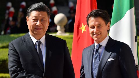Italys Prime Minister Giuseppe Conte (right) and China's President Xi Jinping shake hands upon Xi Jinping's arrival for their meeting at Villa Madama in Rome on March 23, 2019 as part of a two-day visit to Italy.