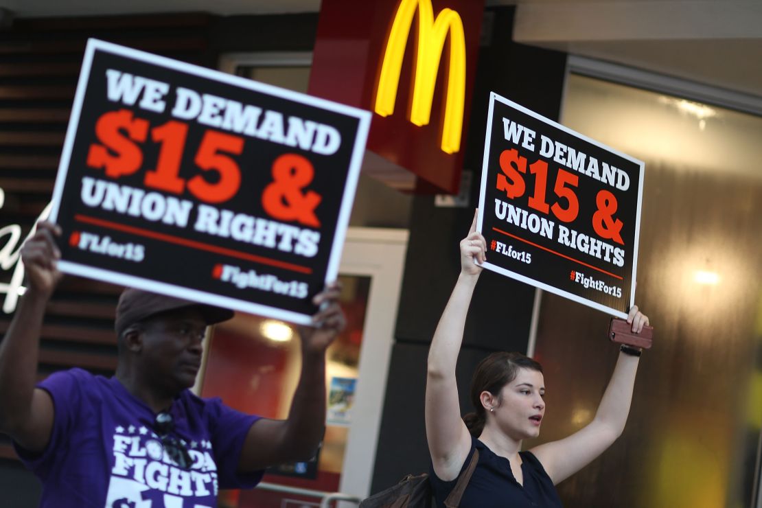 Workers protest outside a McDonald's restaurant on November 10, 2015 in Miami, Florida. 