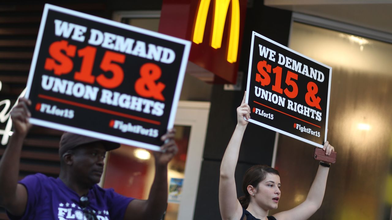 Workers protest outside a McDonald's restaurant on November 10, 2015 in Miami, Florida.