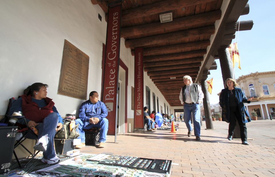 <strong>Historic Santa Fe: </strong>Native American artists sell jewelry at Santa Fe's Palace of the Governors portal. Originally constructed in the early 17th century, Palace of the Governors is now a state history museum.