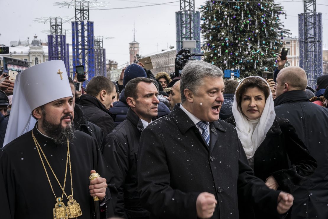 Incumbent President Petro Poroshenko (center) is likely to reach the second round on April 21, according to preliminary results.