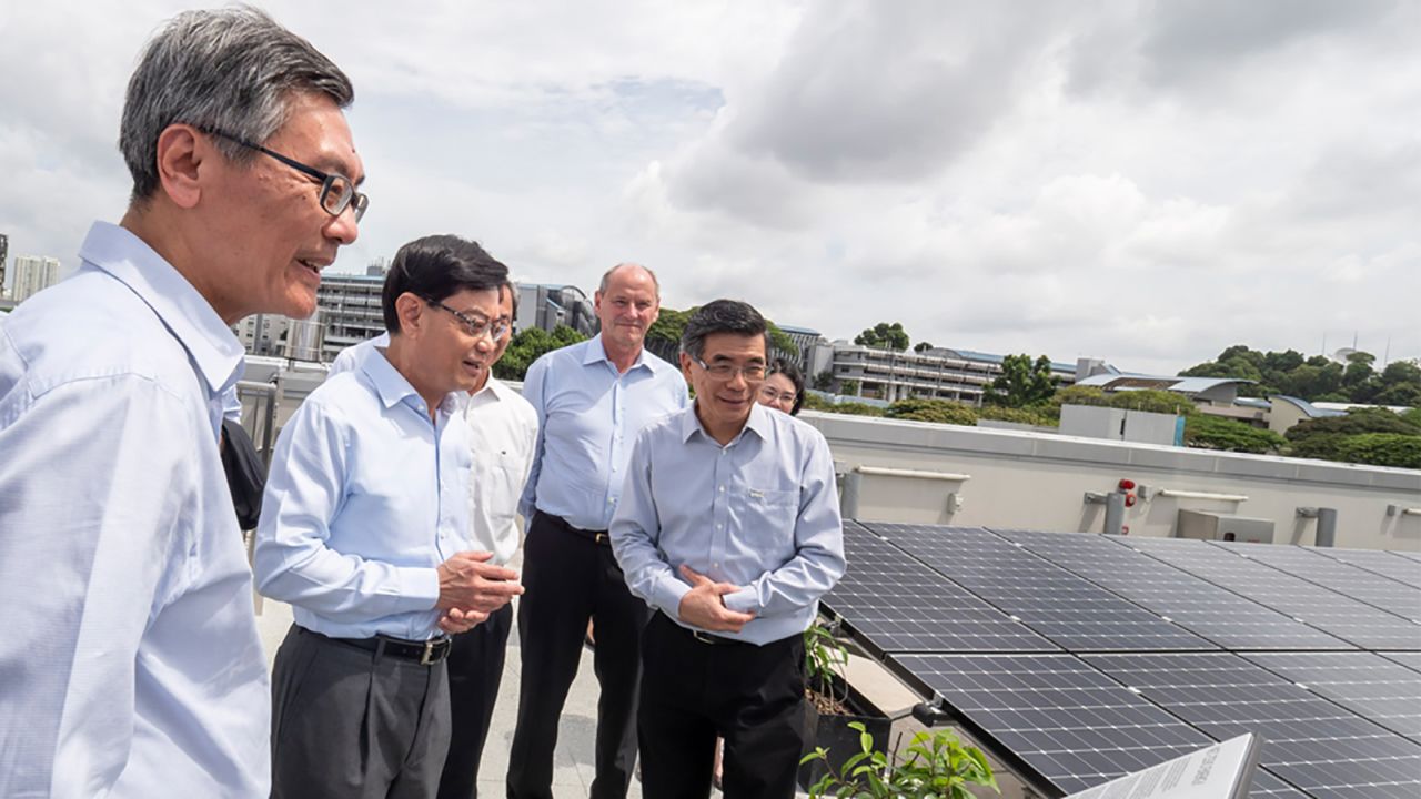 Visitors view the so-called "solar farm" on the building's roof, which contains over 1,200 panels. 