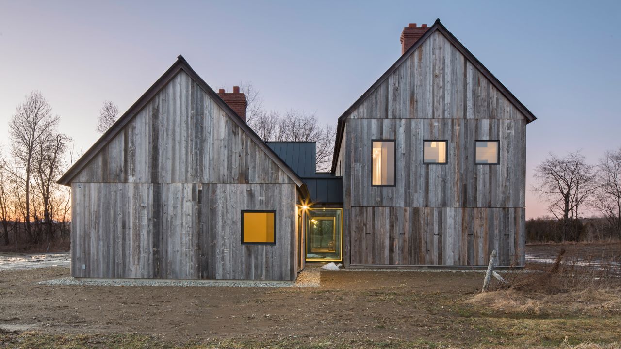 The home is clad in salvaged barn wood to give it a uniform weathered look.