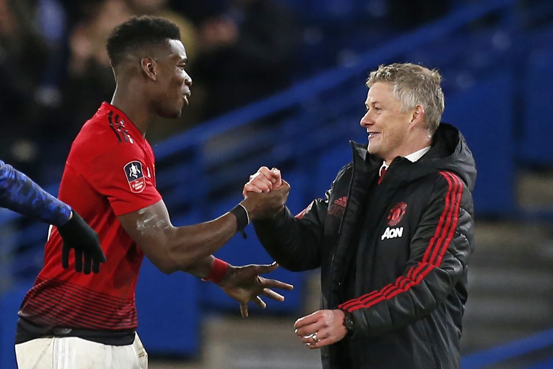 Manchester United manager Ole Gunnar Solskjaer (right) with midfielder Paul Pogba.