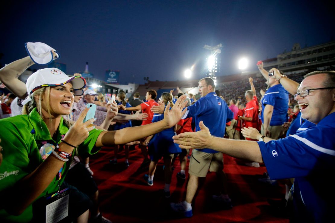 U.S athletes, right, are greeted by volunteers and athletes from the Great Britain at the 2015 Special Olympics World Games in Los Angeles.