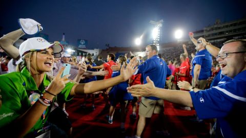 U.S athletes, right, are greeted by volunteers and athletes from the Great Britain at the 2015 Special Olympics World Games in Los Angeles.
