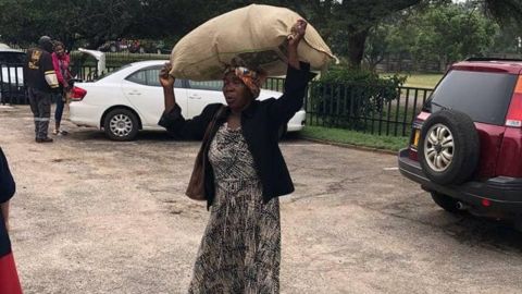 Plaxedes Dilon walked several miles to the Highlands Presbyterian Church in Zimbabwe's capital to deliver donations to cyclone survivors.