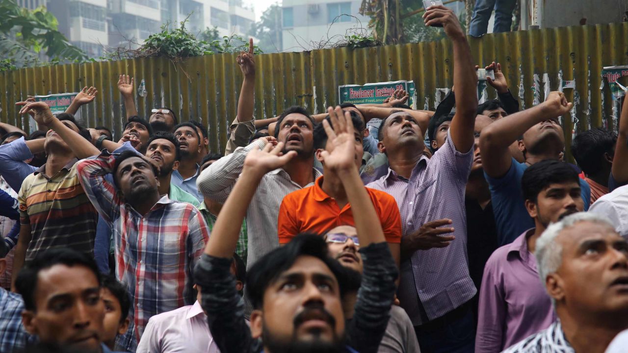A crowd reacts at the scene of the fire.