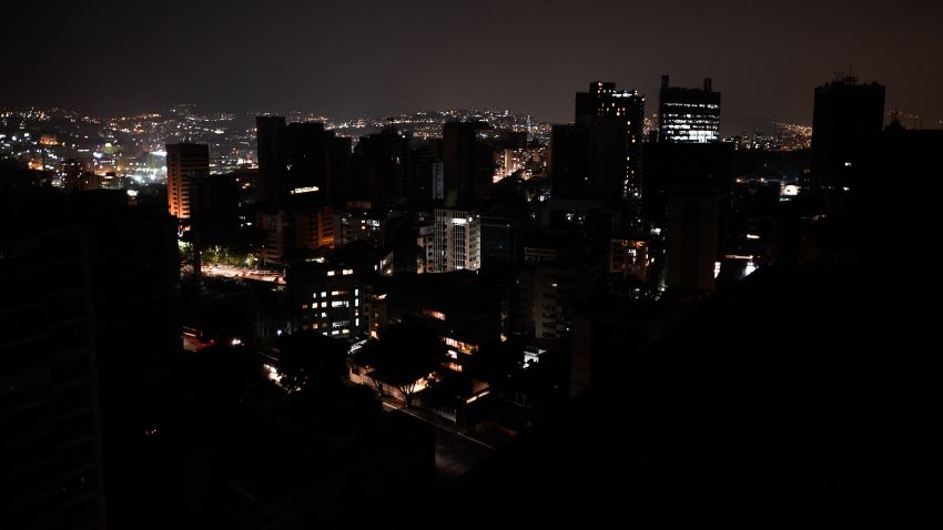 TOPSHOT - General view of Altamira neighborhood partially illuminated during a power outage in Caracas, Venezuela, on March 26, 2019. - Venezuela decreed a 24-hour holiday Tuesday to cope with a new near-nationwide blackout that the government alleged was caused by an "attack" targeting its main hydroelectric plant. (Photo by FEDERICO PARRA / AFP)        (Photo credit should read FEDERICO PARRA/AFP/Getty Images)