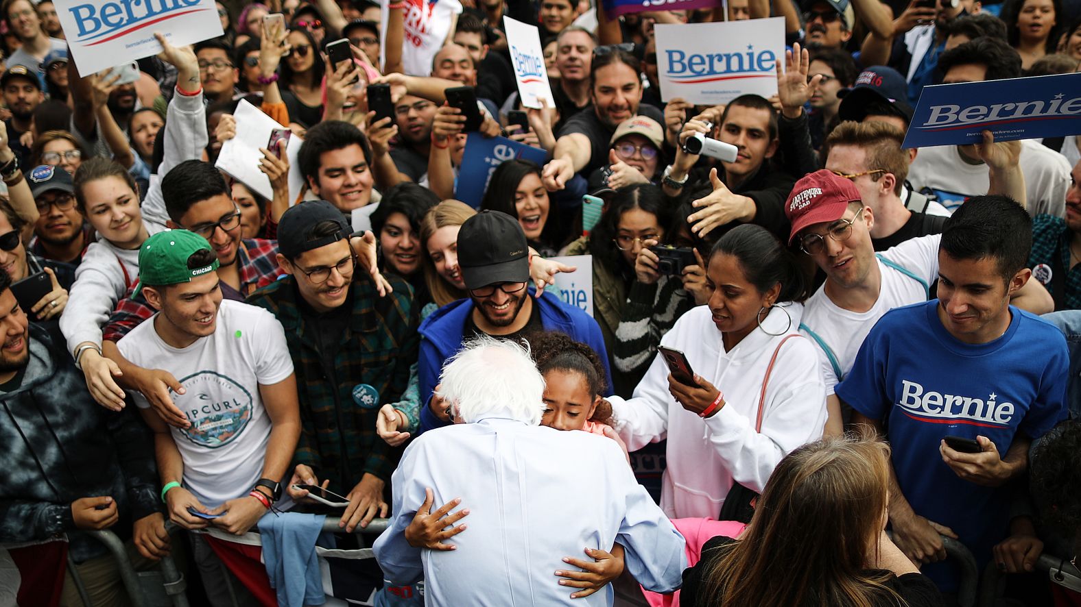 Sanders hugs a young supporter during a campaign rally in Los Angeles in March 2019.