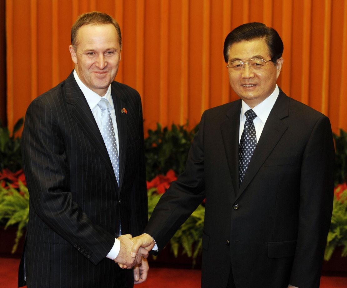 New Zealand Prime Minister John Key (L) shakes hands with Chinese President Hu Jintao during their meeting at the Great Hall of the People in Beijing on April 14, 2009.