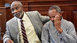 Nathan Myers, left, embraces his uncle, Clifford Williams, during a news conference after their 1976 murder convictions were overturned Thursday, March 28, 2019 in Jacksonville, Fla. The order to vacate the convictions originated from the first ever conviction integrity review unit set up by State Attorney Melissa Nelson.