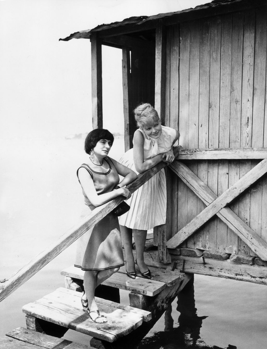 Agnes Varda (left) at the Venice Film Festival in 1962 with Corinne Marchand, star of "Cléo from 5 to 7."