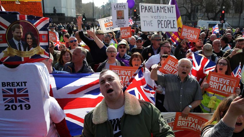 Pro-Brexit demonstrators carry placards and Union flags as they gather in Parliament Square in central London on March 29, 2019. - MPs are set for a momentous third vote today on Prime Minister Theresa May's Brexit deal, which could end a months-long political crisis or risk Britain crashing out of the EU in two weeks. (Photo by Daniel LEAL-OLIVAS / AFP) (Photo credit should read DANIEL LEAL-OLIVAS/AFP/Getty Images)