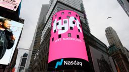 The Lyft logo is shown on the screen at the Nasdaq offices in Times Square on March 29, 2019 in New York. Nasdaq: LYFT, the multimodal transportation network, - Ride-hailing company Lyft made  its Initial Public Offering (IPO) on the Nasdaq Stock Market on March 29.